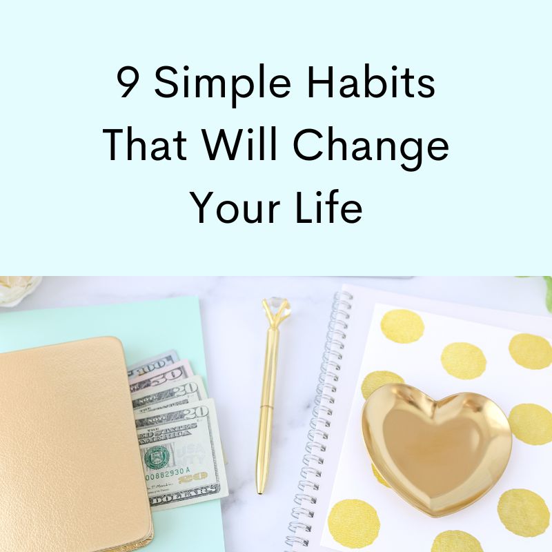 Gold heart shaped dish, US dollar bills, gold pen, notebook with gold polka dots. 